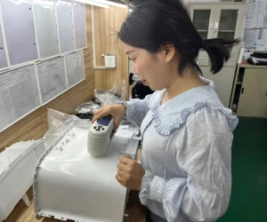 Woman testing plastic product in laboratory